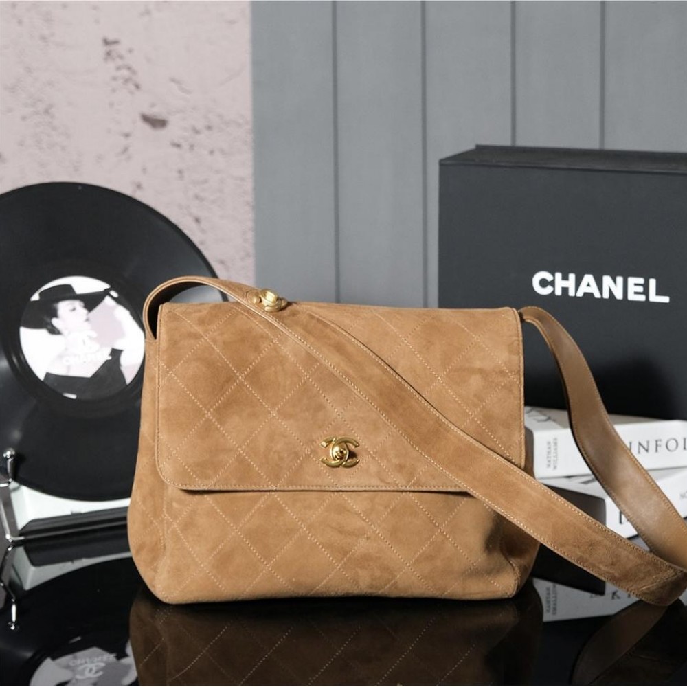 Chanel's iconic Classic Flap bag in brown suede and chain Chanel's iconic Classic Flap bag in brown suede and chain