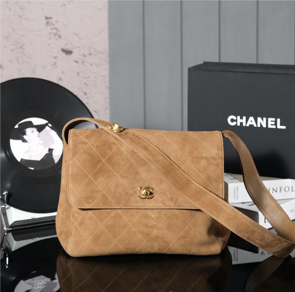 Chanel's iconic Classic Flap bag in brown suede and chain Chanel's iconic Classic Flap bag in brown suede and chain