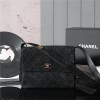 Chanel's iconic Classic Flap bag in black suede and chain Chanel's iconic Classic Flap bag in black suede and chain