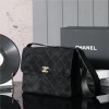 Chanel's iconic Classic Flap bag in black suede and chain Chanel's iconic Classic Flap bag in black suede and chain