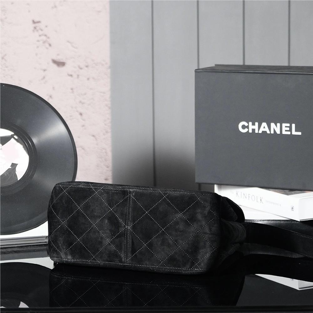 Chanel's iconic Classic Flap bag in black suede and chain Chanel's iconic Classic Flap bag in black suede and chain