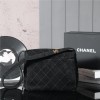 Chanel's iconic Classic Flap bag in black suede and chain Chanel's iconic Classic Flap bag in black suede and chain