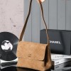 Chanel's iconic Classic Flap bag in brown suede and chain Chanel's iconic Classic Flap bag in brown suede and chain