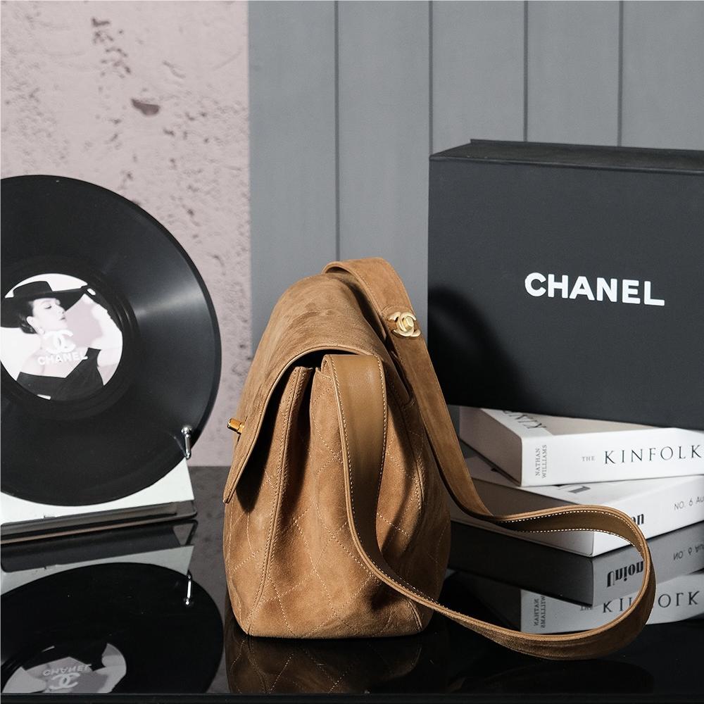 Chanel's iconic Classic Flap bag in brown suede and chain Chanel's iconic Classic Flap bag in brown suede and chain