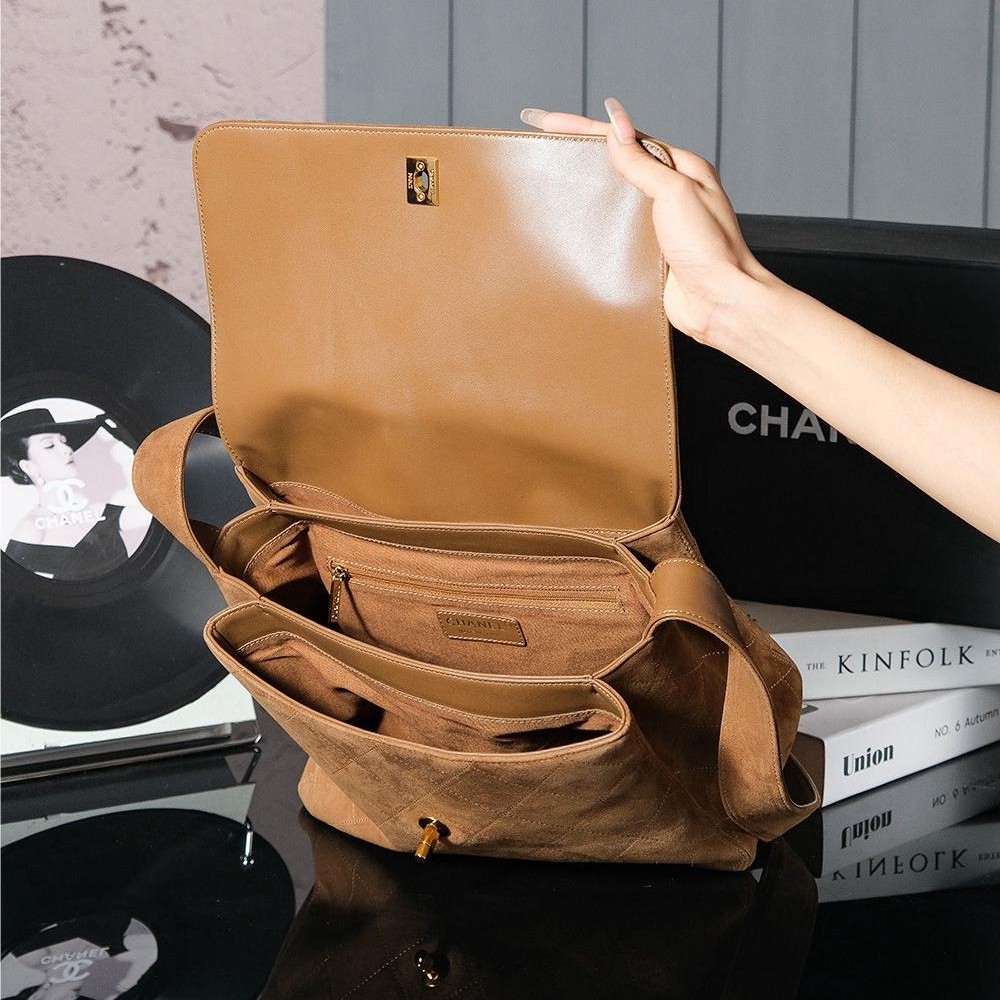 Chanel's iconic Classic Flap bag in brown suede and chain Chanel's iconic Classic Flap bag in brown suede and chain