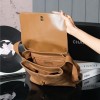 Chanel's iconic Classic Flap bag in brown suede and chain Chanel's iconic Classic Flap bag in brown suede and chain