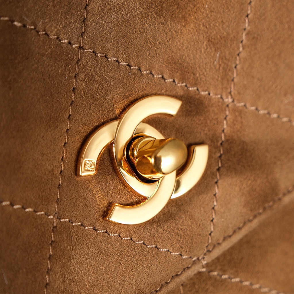 Chanel's iconic Classic Flap bag in brown suede and chain Chanel's iconic Classic Flap bag in brown suede and chain