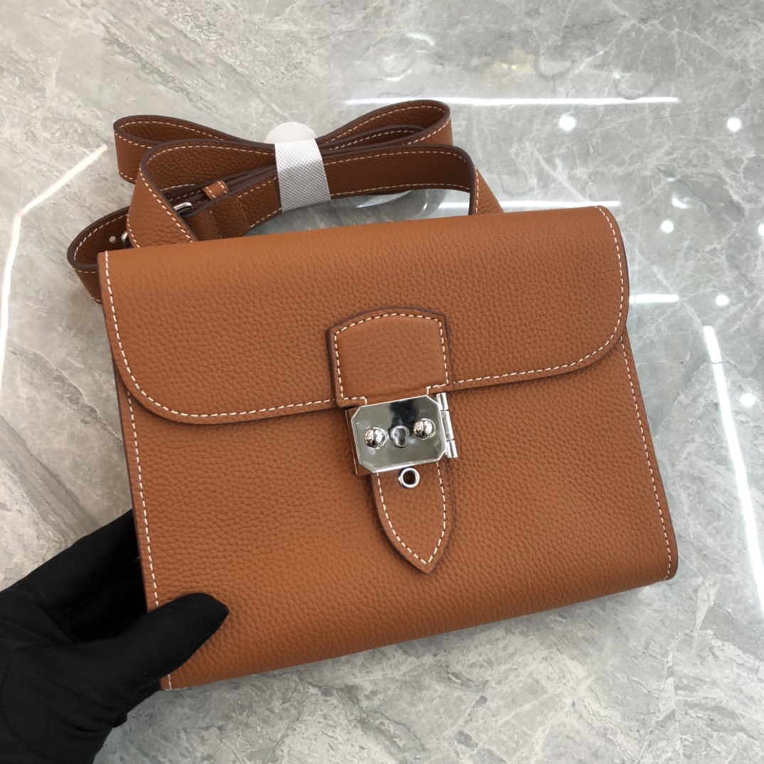 Hermès Roulis series true classic orange and white grain texture pig nose bag Hermès Roulis series true classic orange and white grain texture pig nose bag