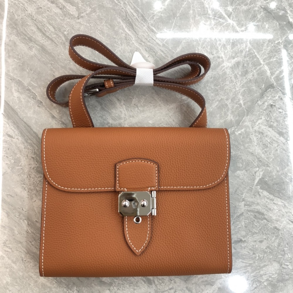 Hermès Roulis series true classic orange and white grain texture pig nose bag Hermès Roulis series true classic orange and white grain texture pig nose bag