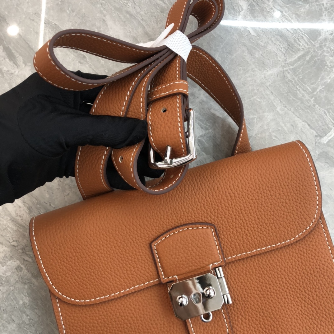 Hermès Roulis series true classic orange and white grain texture pig nose bag Hermès Roulis series true classic orange and white grain texture pig nose bag