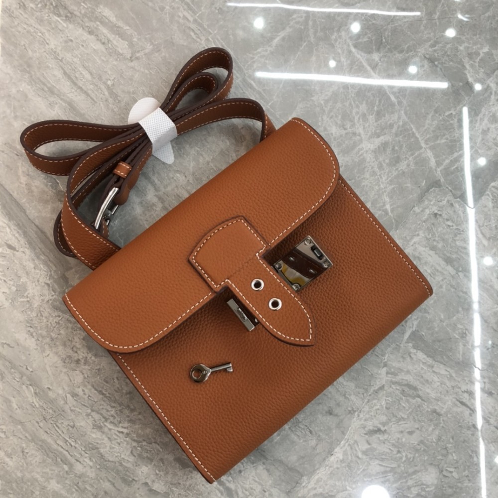 Hermès Roulis series true classic orange and white grain texture pig nose bag Hermès Roulis series true classic orange and white grain texture pig nose bag