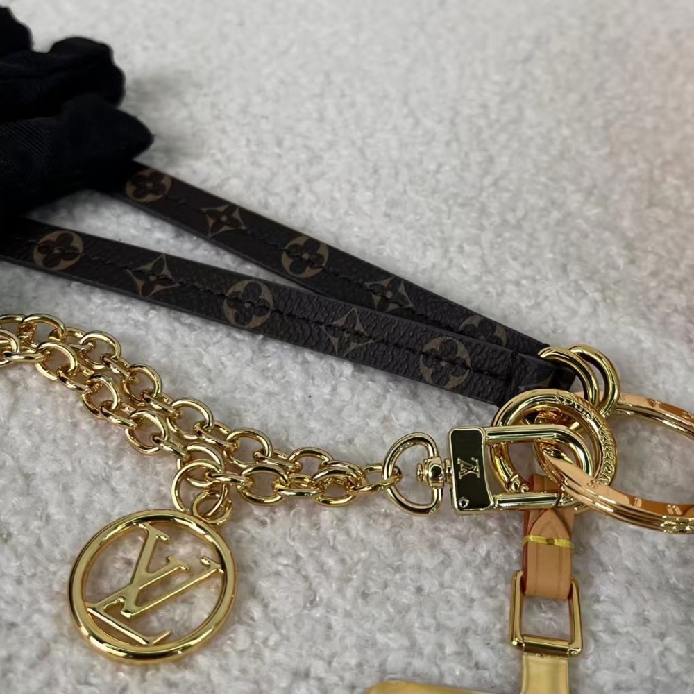 Louis Vuitton exquisite metal and leather phone holder