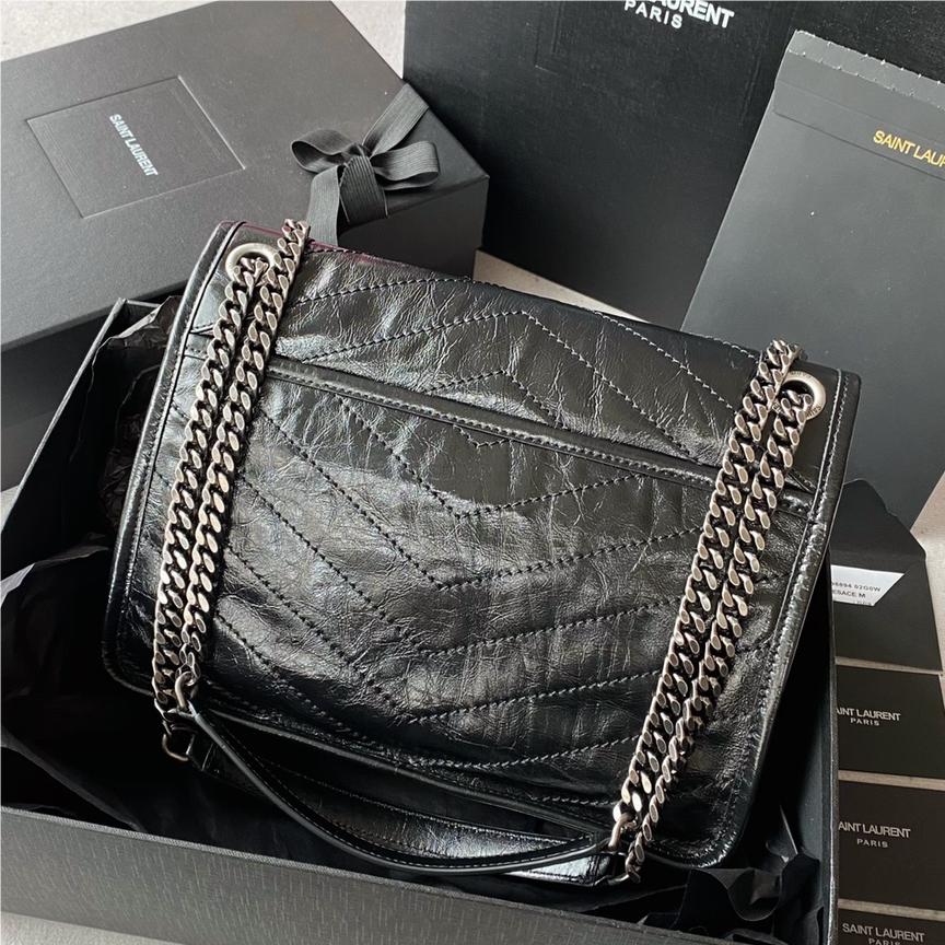 Saint Laurent Niki bag in grey and black grained lambskin. Saint Laurent Niki bag in grey and black grained lambskin.