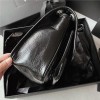 Saint Laurent Niki bag in grey and black grained lambskin. Saint Laurent Niki bag in grey and black grained lambskin.