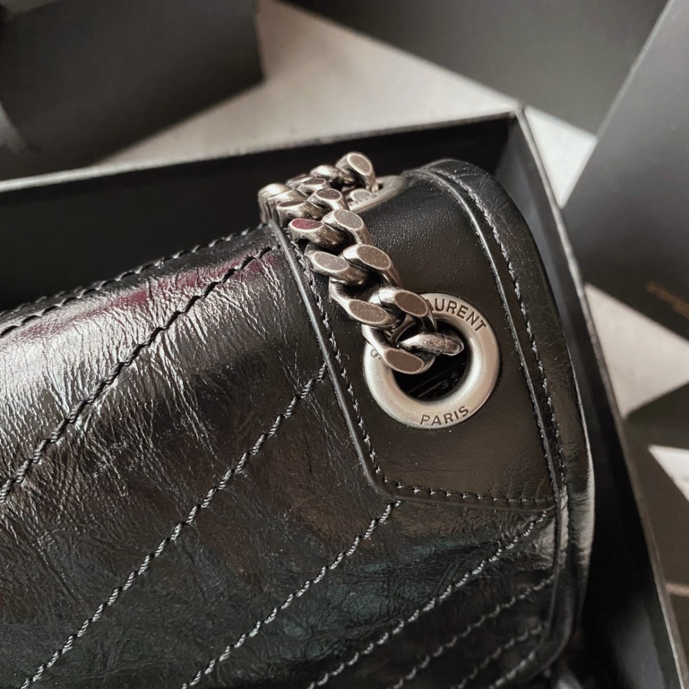 Saint Laurent Niki bag in grey and black grained lambskin. Saint Laurent Niki bag in grey and black grained lambskin.