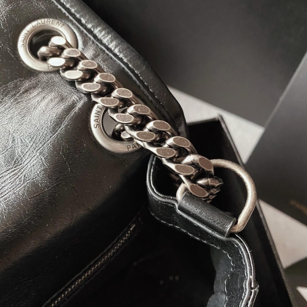 Saint Laurent Niki bag in grey and black grained lambskin. Saint Laurent Niki bag in grey and black grained lambskin.